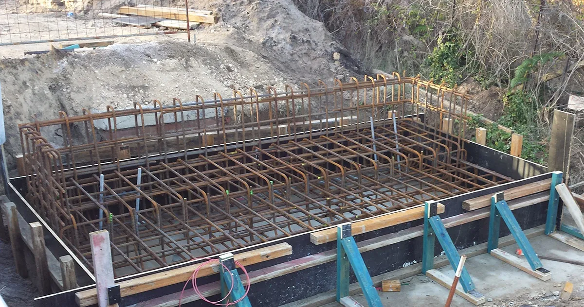 Rebar reinforcement cage in braced formwork at bridge foundation construction site