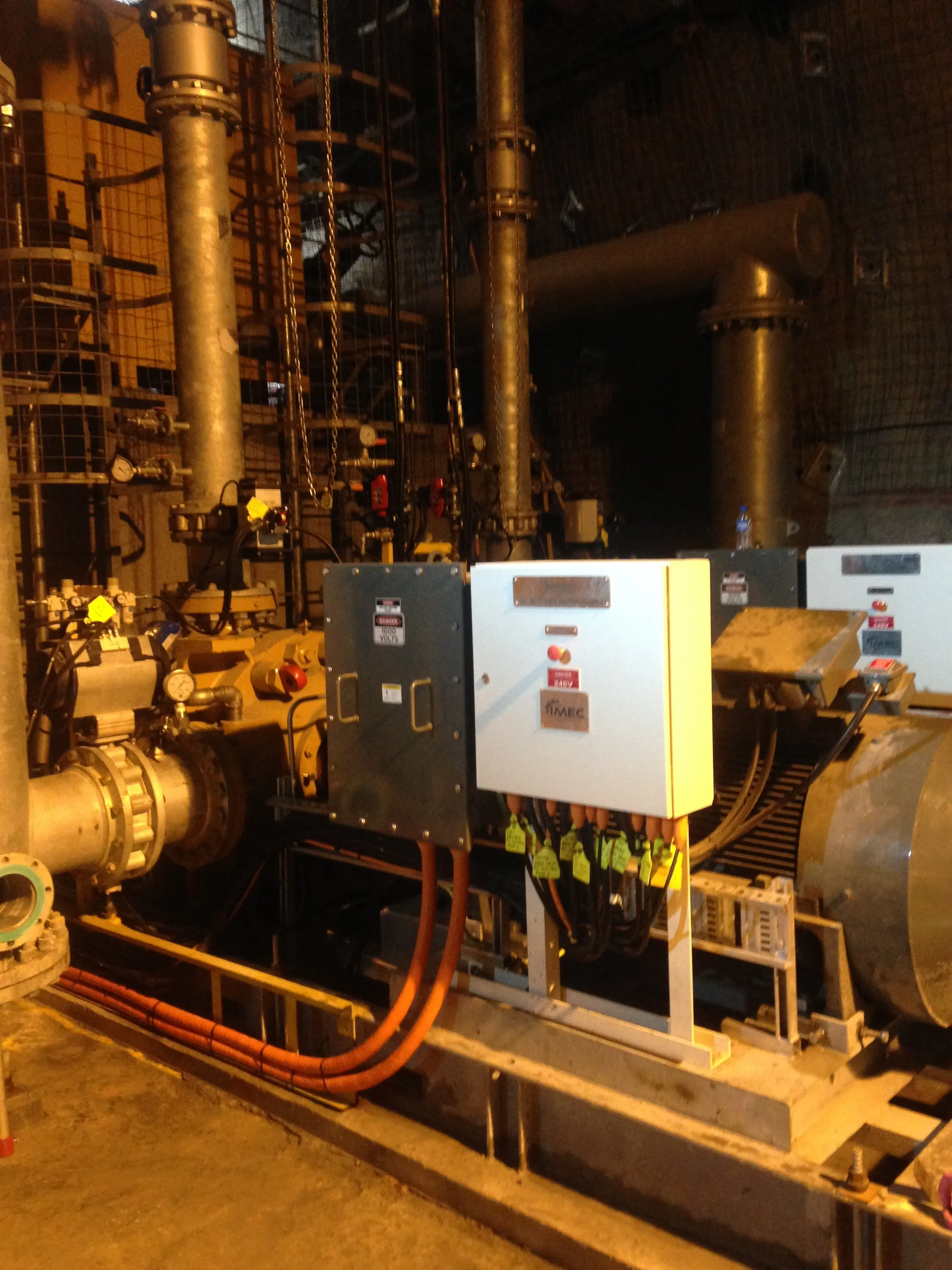 Underground mine dewatering pump station with electrical control cabinets and piping infrastructure