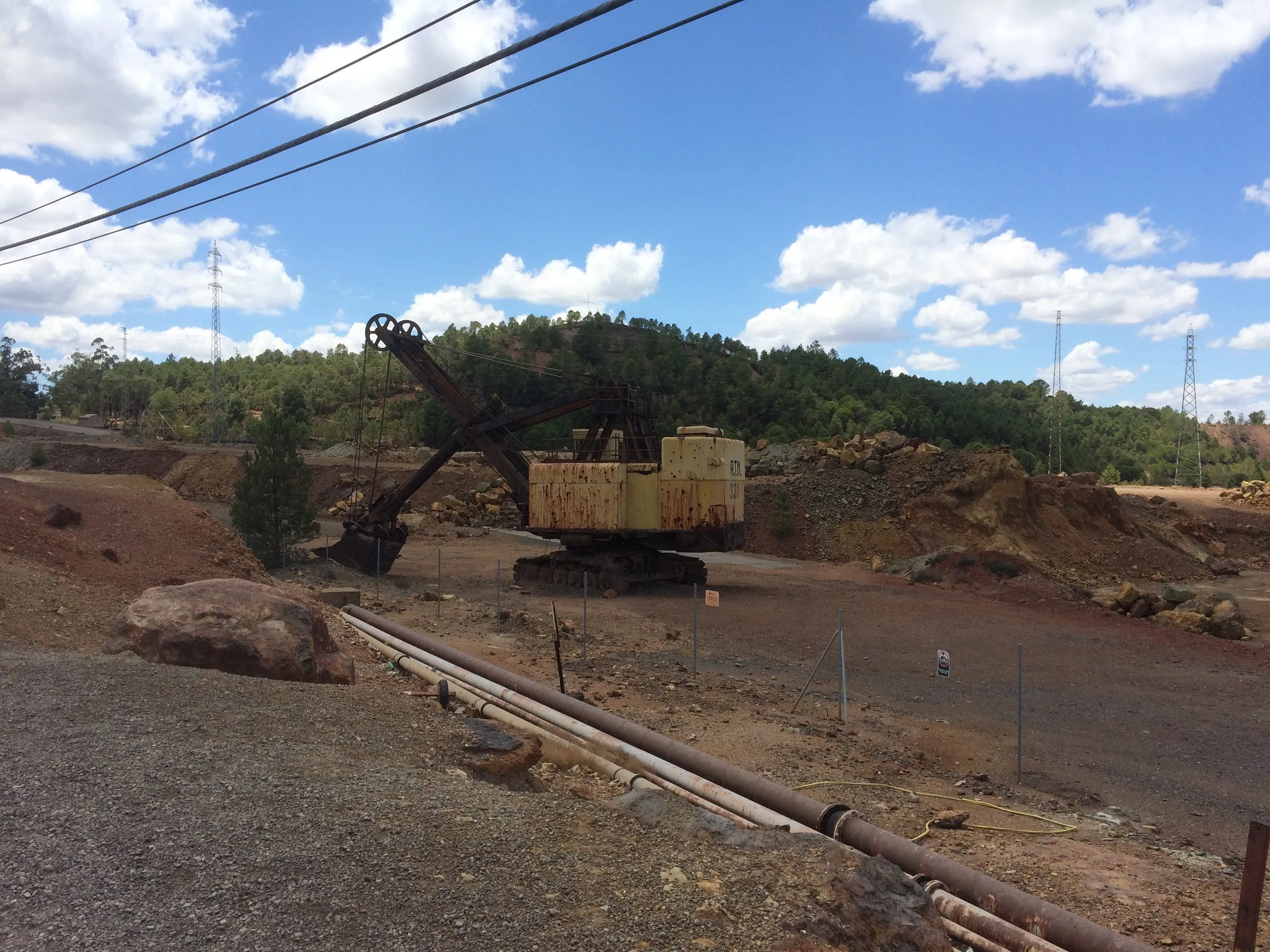 Rusted yellow cable shovel excavator parked at the disused Rio Tinto open-pit mine, Spain