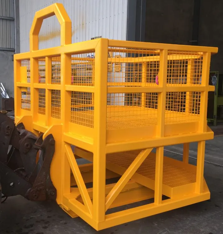 Yellow steel man-riding safety cage with mesh sides and crane-lift hook, mounted for underground mine transport
